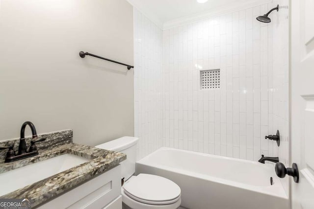 full bathroom featuring vanity, toilet, and tiled shower / bath