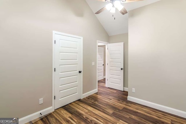 unfurnished bedroom with ceiling fan, dark hardwood / wood-style floors, and high vaulted ceiling