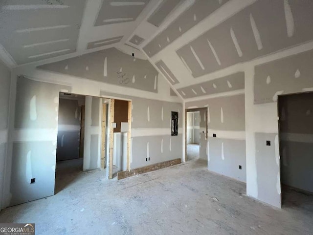 empty room with vaulted ceiling