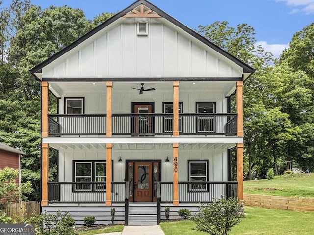 modern inspired farmhouse with ceiling fan, a balcony, a front lawn, and a porch