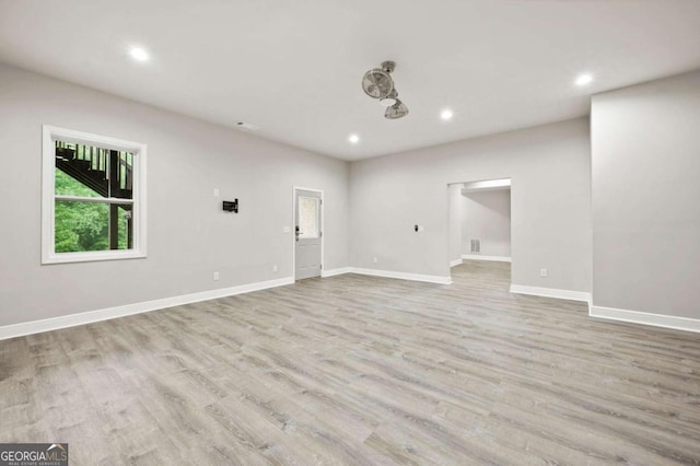 unfurnished room featuring light hardwood / wood-style floors