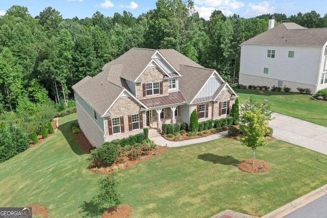 view of front of home with a porch and a front yard