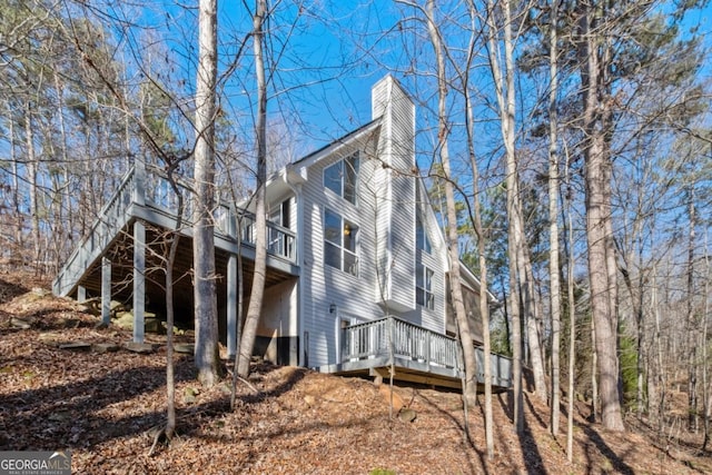 view of side of home featuring a deck