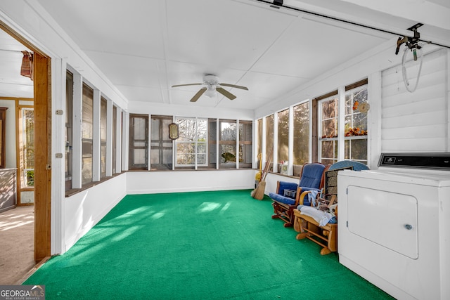 sunroom / solarium with ceiling fan and washer / clothes dryer