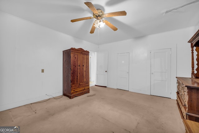 unfurnished bedroom featuring ceiling fan and light colored carpet