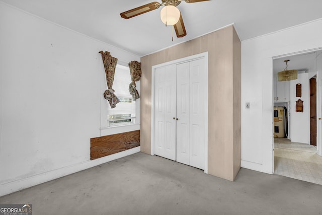 unfurnished bedroom featuring a closet, ceiling fan, and water heater