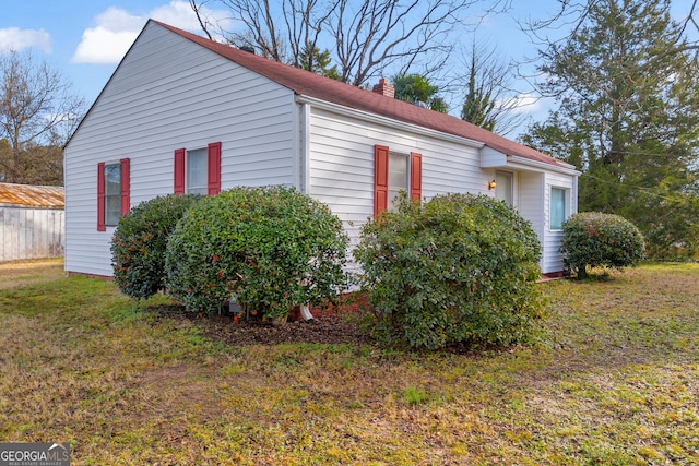 view of home's exterior featuring a yard