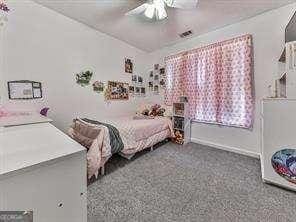 bedroom featuring carpet flooring and ceiling fan