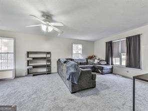 living room with ceiling fan