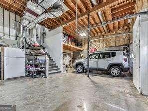 garage featuring white fridge