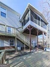 exterior space featuring a deck and a sunroom