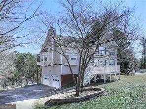 view of home's exterior featuring a lawn and a garage