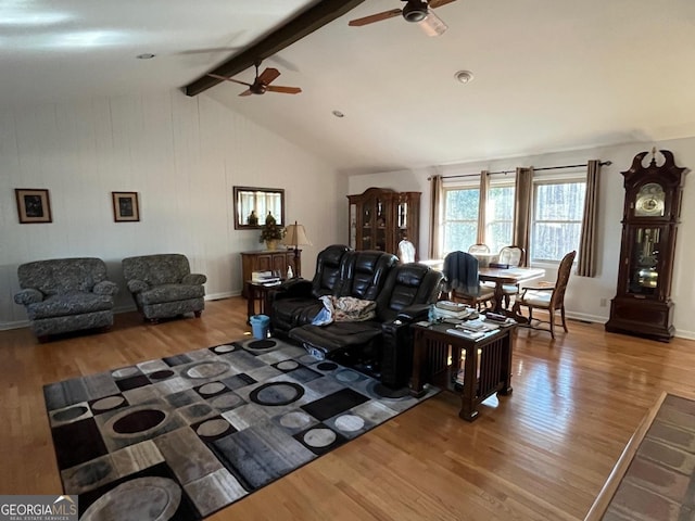 living room featuring wood-type flooring, vaulted ceiling with beams, and ceiling fan