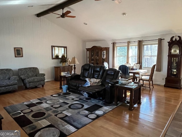 living room with lofted ceiling with beams, ceiling fan, and wood-type flooring