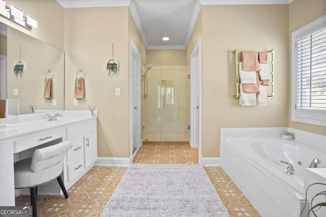 bathroom featuring plus walk in shower, vanity, a wealth of natural light, and crown molding