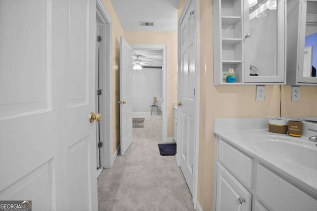 bathroom with ceiling fan and vanity