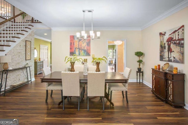 dining space featuring dark wood-type flooring, a chandelier, and ornamental molding