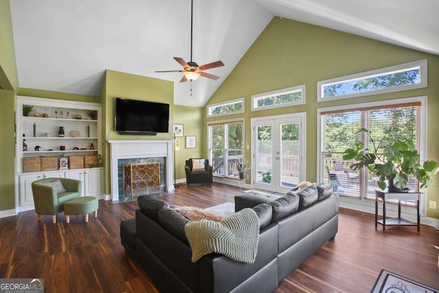 living room featuring built in shelves, ceiling fan, french doors, high vaulted ceiling, and dark hardwood / wood-style floors