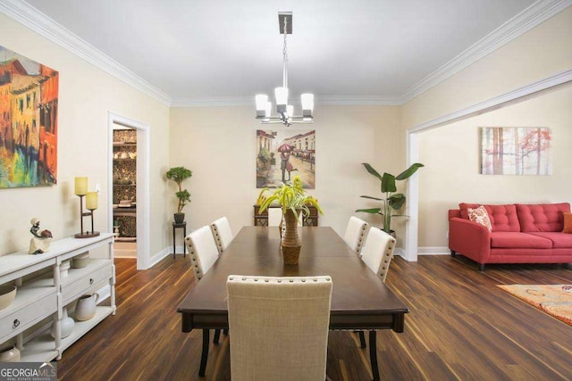 dining room with crown molding, dark wood-type flooring, and a chandelier