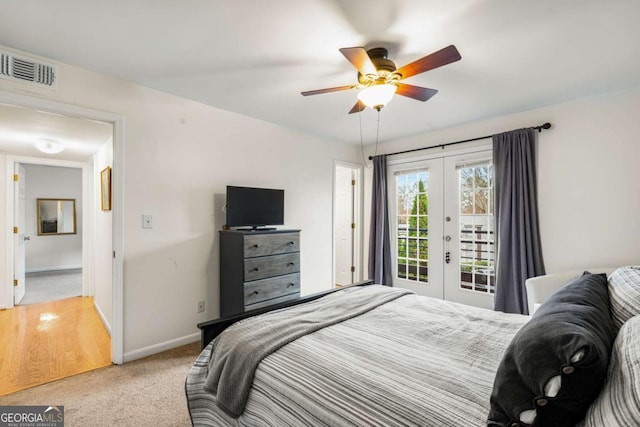 bedroom featuring access to outside, ceiling fan, french doors, and light colored carpet