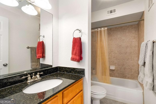 full bathroom featuring shower / bath combo, vanity, toilet, and tile patterned floors