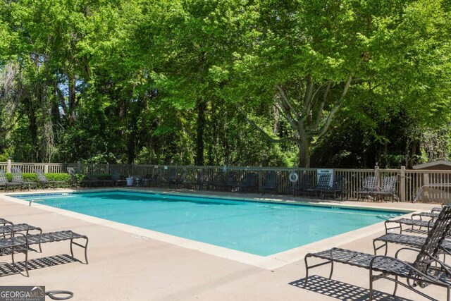 view of swimming pool featuring a patio area