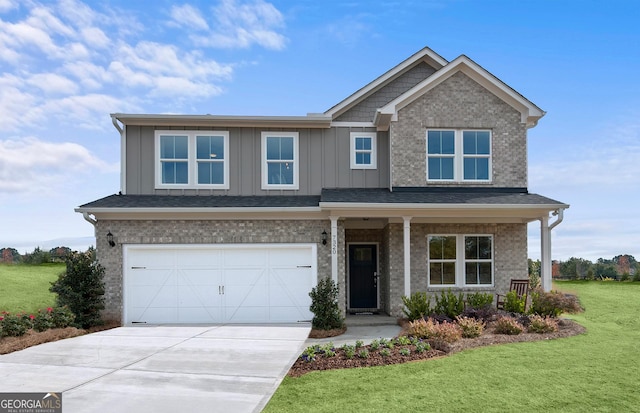 craftsman-style house featuring a front yard and a garage