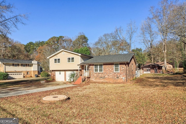 view of front of home featuring a garage and a front lawn