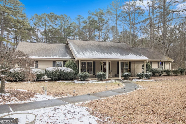 single story home featuring a porch