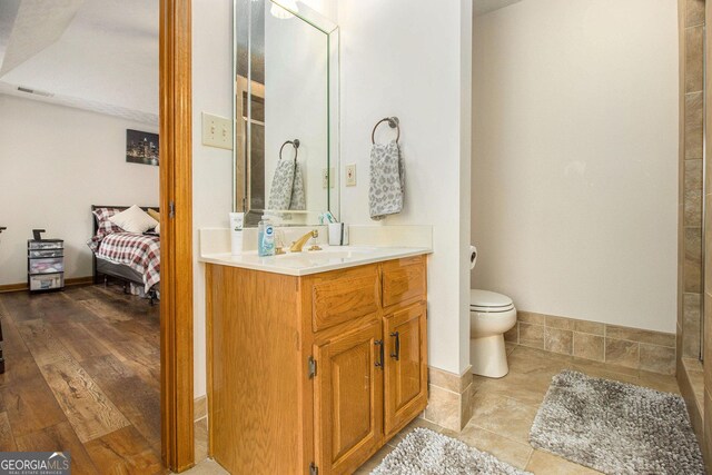 full bathroom featuring a shower stall, tile patterned flooring, and vanity