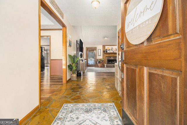 entryway featuring a fireplace