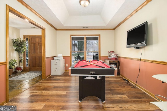 game room with a raised ceiling, dark hardwood / wood-style floors, and billiards