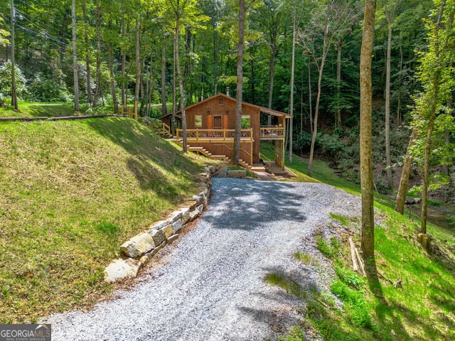 view of yard featuring a wooden deck