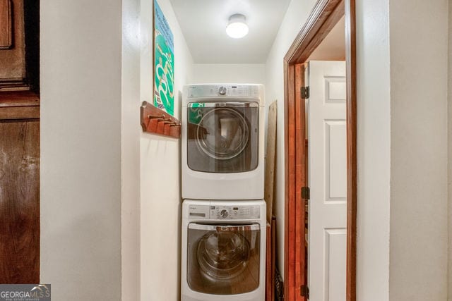 laundry area featuring stacked washing maching and dryer