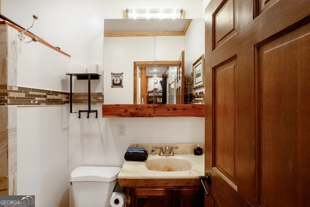 bathroom with vanity and toilet