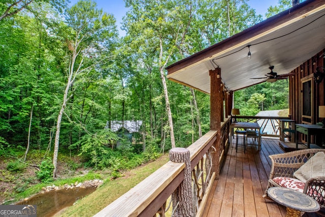 wooden terrace with ceiling fan