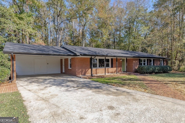 single story home with a front yard and a carport