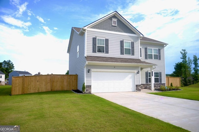 view of front facade with a garage and a front lawn