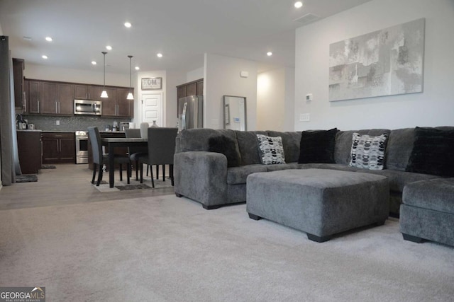 living room with light colored carpet