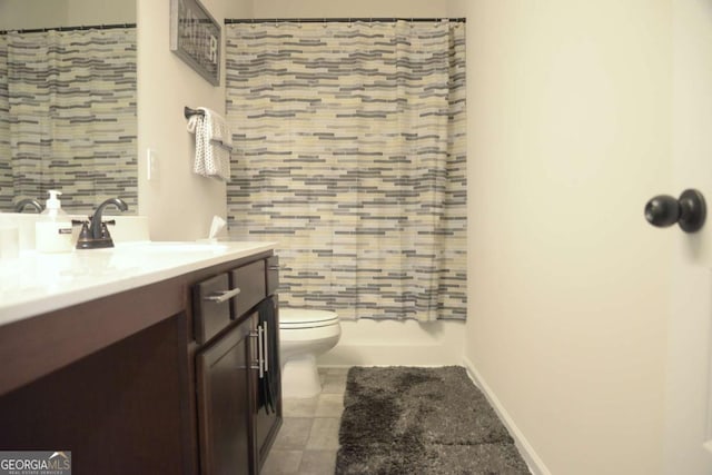 bathroom with vanity, a shower with curtain, tile patterned floors, and toilet