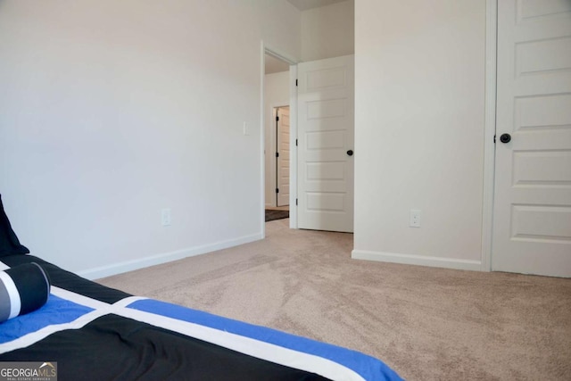 unfurnished bedroom with carpet