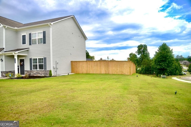 view of home's exterior with a lawn