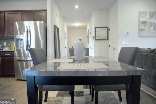 dining area featuring wood-type flooring