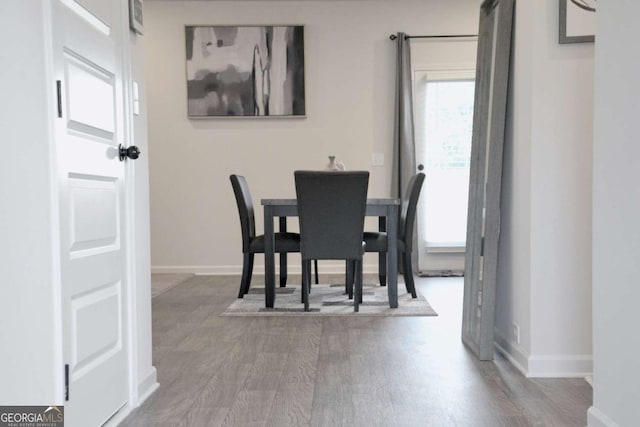 dining space featuring hardwood / wood-style flooring