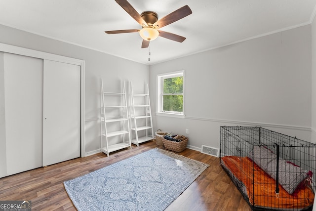 interior space featuring a closet, ceiling fan, and hardwood / wood-style floors