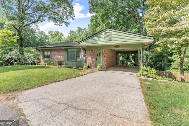 ranch-style home featuring a front yard and a carport