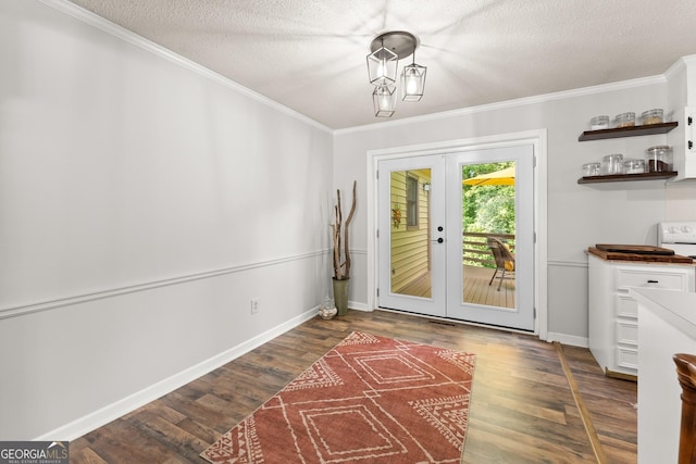 doorway to outside featuring dark hardwood / wood-style floors, crown molding, a textured ceiling, and french doors