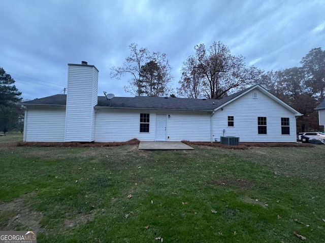 back of house featuring a patio area, a yard, and cooling unit