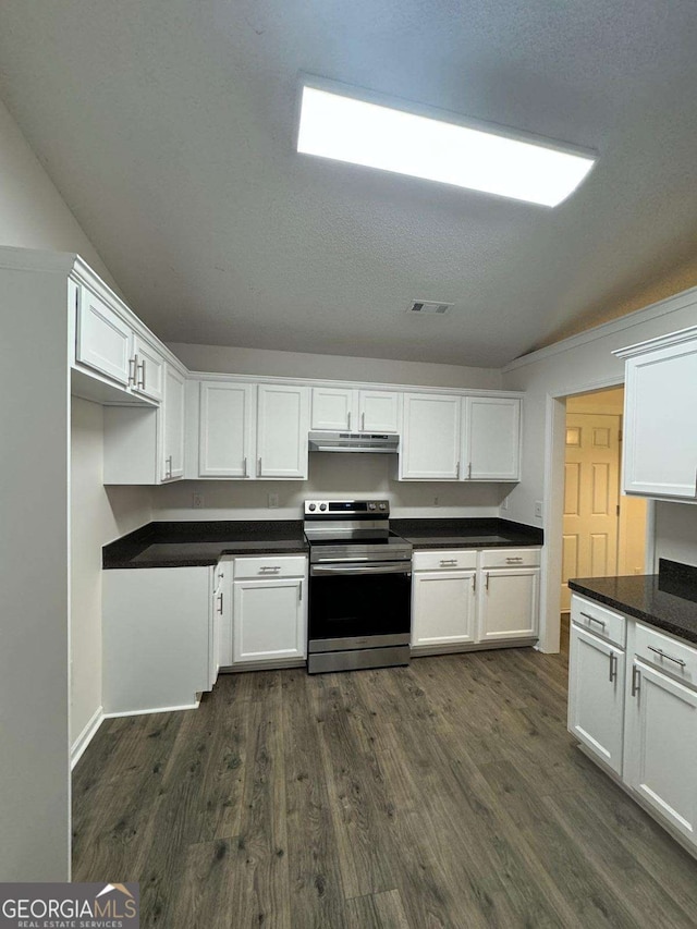 kitchen featuring white cabinets, stainless steel electric range oven, dark wood-type flooring, and a textured ceiling