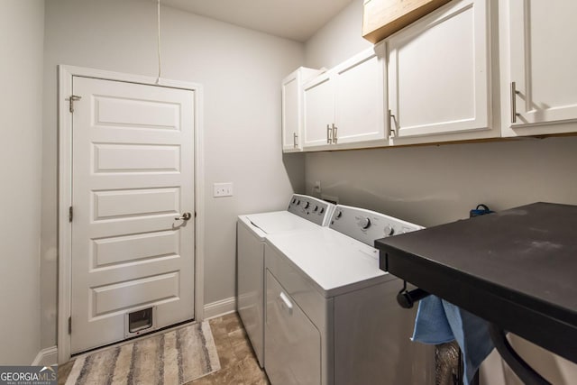 laundry room with cabinets and independent washer and dryer